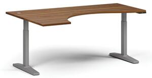 Výškově nastavitelný stůl, elektrický, 675-1325 mm, ergonomický levý, deska 1800x1200 mm, šedá podnož, ořech