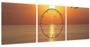 Obraz - Západ slunce nad oceánem (s hodinami) (90x30 cm)