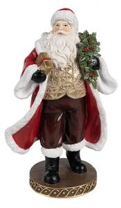 Červená vánoční dekorace Santa Claus na hnědém podstavci držící dárek a vánoční bobule – 23 cm