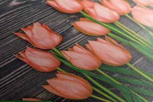Obraz očarující oranžové tulipány na dřevěném podklade