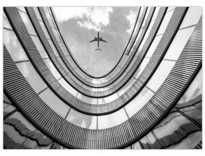 Obraz - Letadlo nad budovou (70x50 cm)