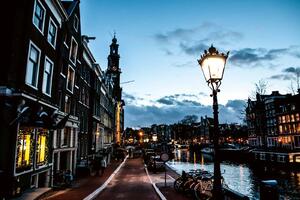 DIMEX | Vliesová fototapeta Amsterdam v noci MS-5-1003 | 375 x 250 cm| modrá, měděná, černá, šedá