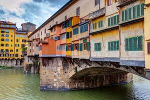 DIMEX | Vliesová fototapeta Ponte Vecchio, Florencie MS-5-1189 | 375 x 250 cm| zelená, vicebarevna, béžová, žlutá, oranžová