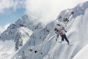 DIMEX | Vliesová fototapeta Snowboardista na horách MS-5-1571 | 375 x 250 cm| modrá, bílá