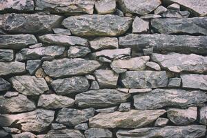 DIMEX | Vliesová fototapeta Hrubá kamenná zeď MS-5-2396 | 375 x 250 cm| černá, šedá