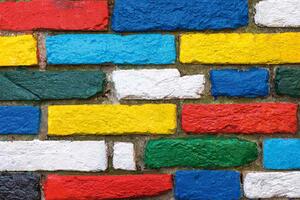 DIMEX | Vliesová fototapeta Malovaná cihlová zeď MS-5-2675 | 375 x 250 cm | zelená, modrá, červená, bílá, žlutá