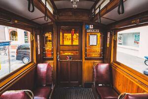 DIMEX | Vliesová fototapeta Stará červená tramvaj MS-5-2890 | 375 x 250 cm | červená, bílá, hnědá
