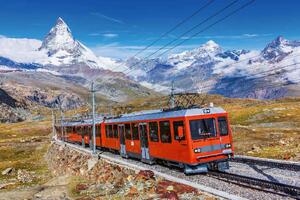 DIMEX | Vliesová fototapeta Zermatt, Švýcarsko MS-5-2895 | 375 x 250 cm | modrá, červená, bílá