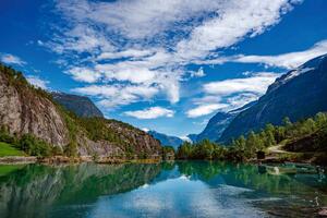 DIMEX | Vliesová fototapeta Norská přírodní krajina MS-5-3082 | 375 x 250 cm | zelená, modrá, bílá