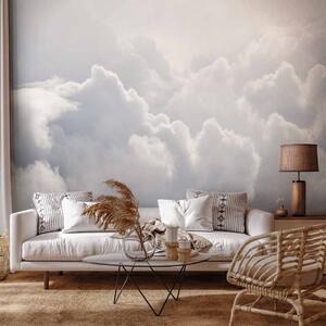 Fototapeta Pohledy z okna letadla - krajina hustých bílých oblaků na obloze