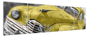 Obraz žlutého auta na louce (170x50cm)