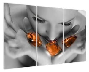 Obraz - oranžové kameny v dlani (120x80cm)