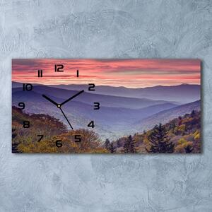 Skleněné hodiny na stěnu Západ slunce hory pl_zsp_60x30_f_67690811