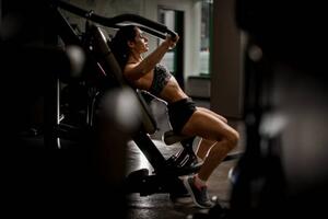 Fotografie View of sportive woman doing exercises, MaximFesenko