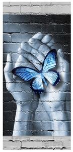 Fototapeta na dveře Modrý motýl na dlaních Materiál: Samolepící, Rozměry: 95 x 205 cm