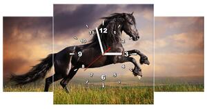 Obraz s hodinami Silný černý kůň - 3 dílný Rozměry: 90 x 70 cm