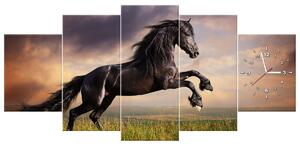 Obraz s hodinami Silný černý kůň - 5 dílný Rozměry: 150 x 70 cm