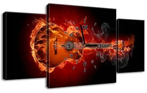 Obraz s hodinami Hořící kytara - 3 dílný Rozměry: 100 x 70 cm