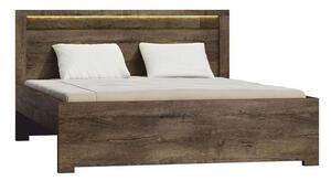 Manželská postel z tmavého jasanu s výraznou reliéfní kresbou TK210