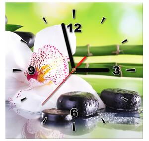 Obraz s hodinami Bílá orchidej a kameny Rozměry: 100 x 40 cm