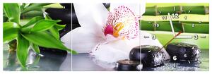 Obraz s hodinami Bílá orchidej a kameny - 3 dílný Rozměry: 90 x 30 cm