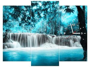 Obraz s hodinami Vodopád v modré džungli - 3 dílný Rozměry: 80 x 40 cm