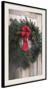 Plakát Vánoční věnec - kulatá smrková dekorace zavěšená na dveřích