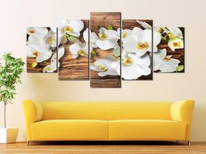 Obraz Esence (5-dílný) - květy orchidejí na pozadí dřevěné textury
