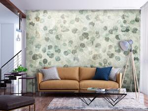 Fototapeta Rostlinný tanec - jemné listy v zeleni na pozadí s texturou betonu