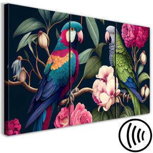 Obraz Tropickí ptáci - exotičtí papoušci mezi kvetoucími stromy