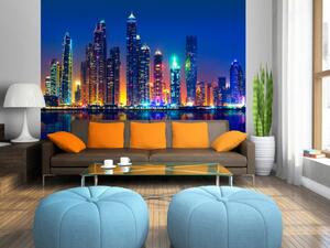Fototapeta Modré noci v Dubaji - panorama s mrakodrapy a odrazem ve vodě