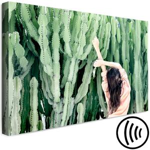 Obraz Kaktusová krajina (1-dílný) - Ženská postava a zelené rostliny