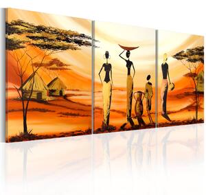 Obraz Africká vesnice (3dílný) - postavy na pozadí sluneční přírody
