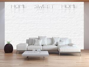 Fototapeta Home sweet home - béžový nápis na bílé cihle se stínem a odrazem