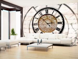 Fototapeta Plynutí času - velký hodiny se stínem na béžovém pozadí s nápisy