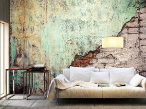 Fototapeta Kamenná disharmonie - barevné pozadí s texturou cihel a betonu
