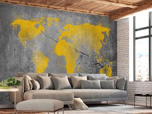 Fototapeta Průmyslový svět - žlutá mapa kontinentů na pozadí s texturou betonu