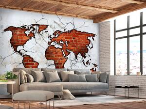 Fototapeta Mapa světa - kontinenty z červené cihly na pozadí s texturou betonu