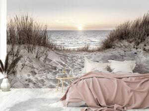 Fototapeta Pláž snů - krajina s mořem a písčitou pláží při západu slunce