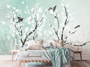 Fototapeta Stromy s bílými květy - ptáci na větvích na jaře na mořském pozadí