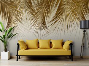 Fototapeta Pod tropickou rostlinou - rozložité větve palmy se zlatými listy