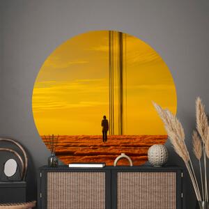 Kulatá fototapeta Osamělost v mracích - postava na pozadí intenzivní žluté oblohy