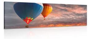 Obraz přelet balónů nad horami - 150x50 cm