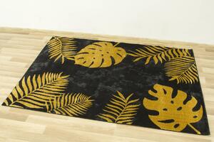 Makro Abra Moderní kusový koberec FESTIVAL 5869A Listy palem černý žlutý Rozměr: 80x150 cm