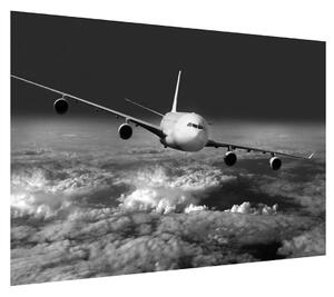 Černobílý obraz letadla v oblacích (100x70 cm)