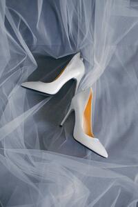 Umělecká fotografie Bride's shoes with a veil top view close-up, Artem Sokolov, (26.7 x 40 cm)