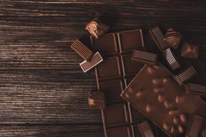 Umělecká fotografie Chocolate bars with nuts and candies close-up., Olena Ruban, (40 x 26.7 cm)