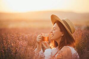 Fotografie Young happy woman drinking herbal tea,, Polina Lebed, (40 x 26.7 cm)