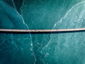 Fotografie Driving on a bridge over deep blue water, HRAUN