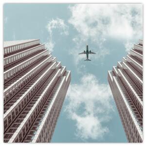 Obraz letadla mezi budovami (30x30 cm)